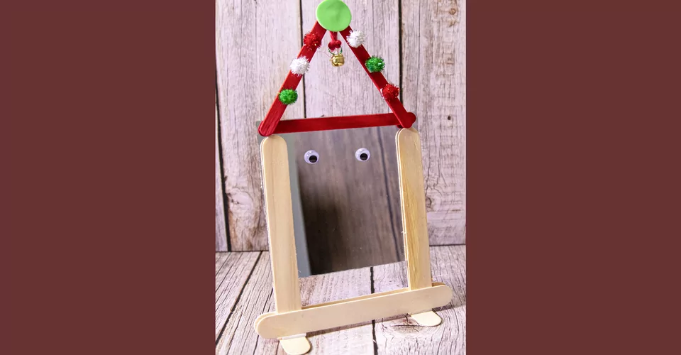 Mirror in wooden frame made of wooden sticks